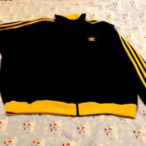 Black Adidas sweat jacket with yellow stripes